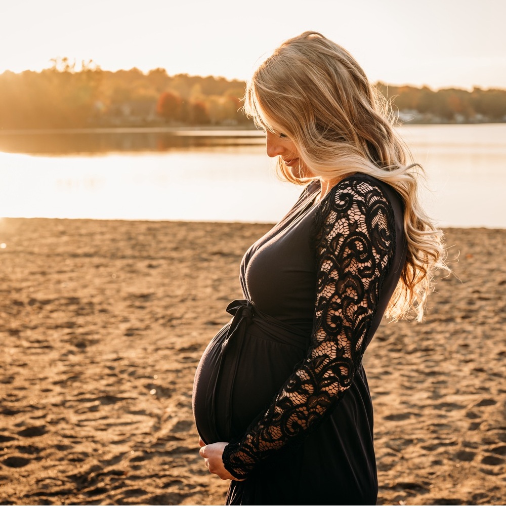 Blue floor length dress, floral sleeves.